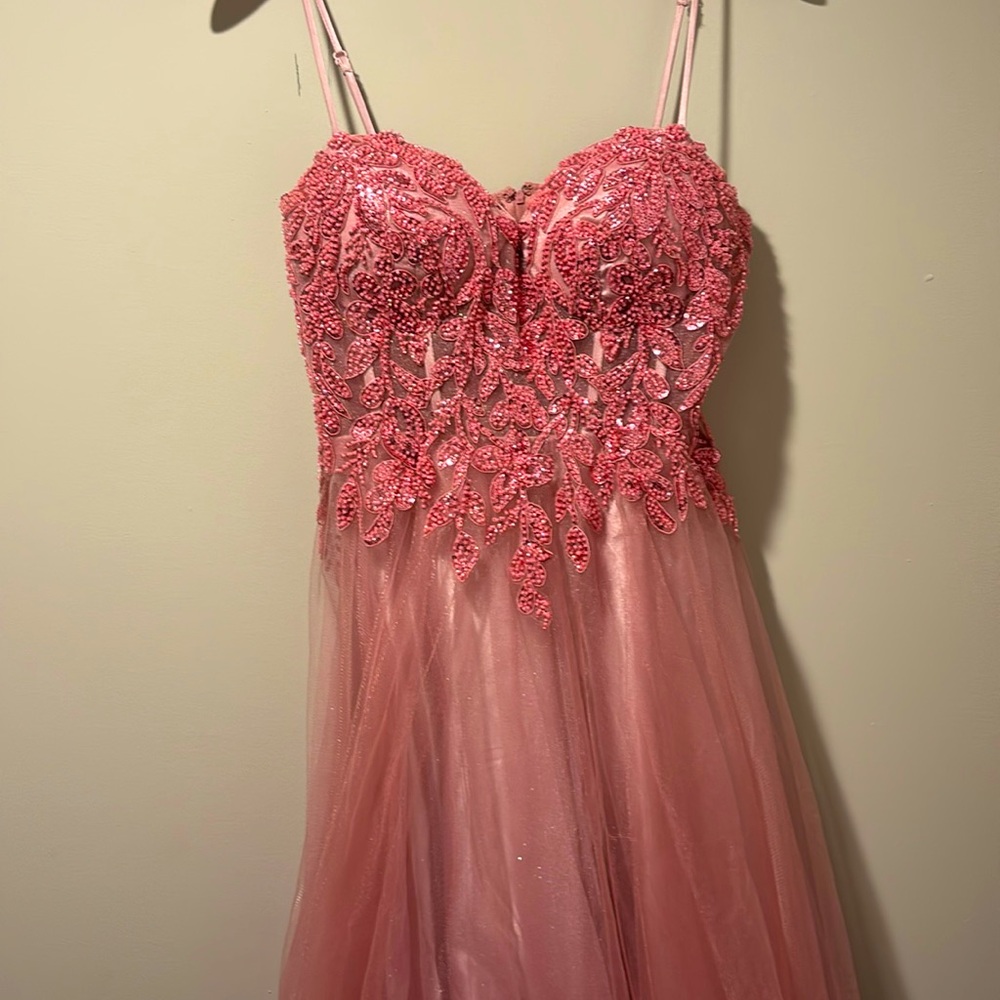 Prom Dress. It is an XS but runs big. I’m usually a size 3-5 with larger chest